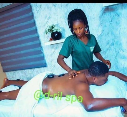 Hot stone massage therapy in session at D-Ril Spa